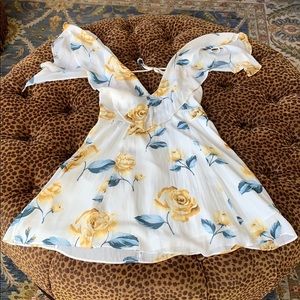 White dress with Blue and Yellow floral roses.